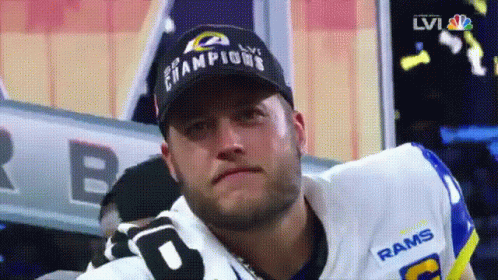 Man in Rams Jersey and Champions Hat