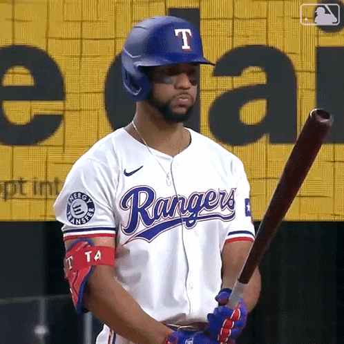 Man in Rangers Uniform Holding Baseball Bat