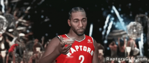 Man In Raptors Jersey Holding Drink GIF