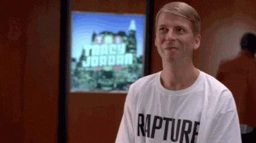 Man In Rapture T-Shirt In Front Of Tracy Jordan Screen GIF