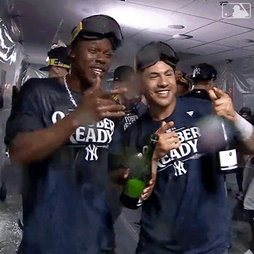 Man In Ready Shirt Holding Champagne GIF