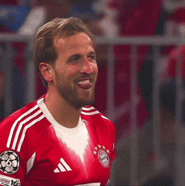 Man in Red Adidas Jersey Sticking Out Tongue