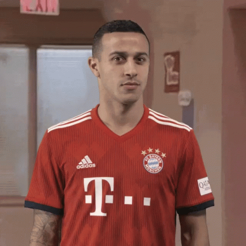 Man in Red Adidas Jersey with Letter T