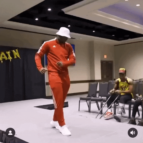 Man in Red Adidas Outfit Dancing