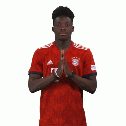Man in Red Adidas Shirt Saying Qatar
