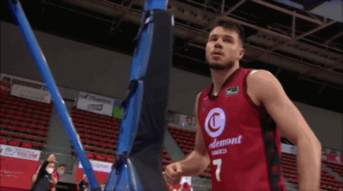 Man in Red and Black Basketball Jersey Number 7