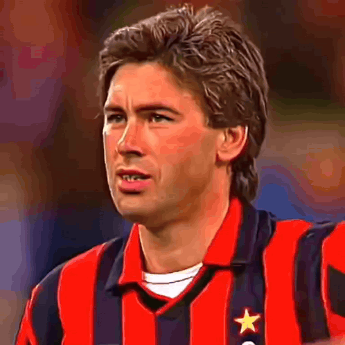 Man in Red and Black Striped Shirt with Star