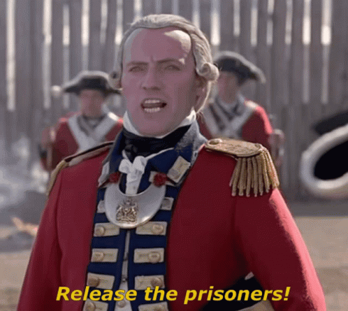 Man In Red And Blue Uniform Saying Release The Prisoners GIF