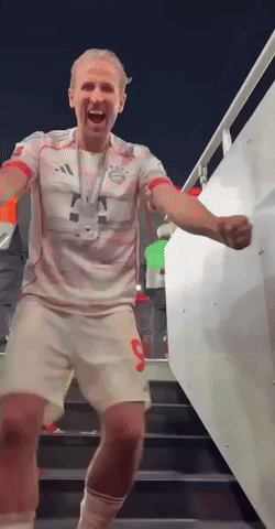 Man in Red and White Adidas Shirt on Stairs