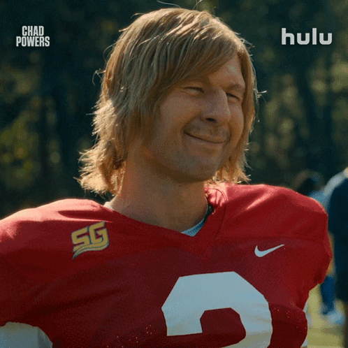 Man in Red and White Football Jersey Number 5