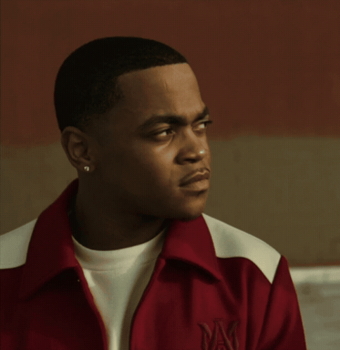 Man in Red and White Jacket With Letter M