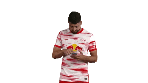 Man in Red and White Jersey Talking on Phone