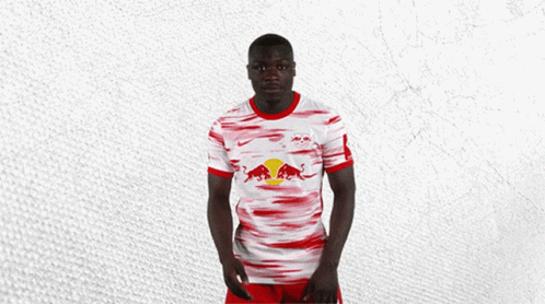 Man In Red And White Jersey With Red Bull GIF