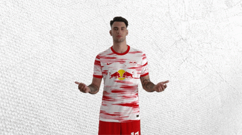 Man In Red And White Jersey With Red Bull GIF