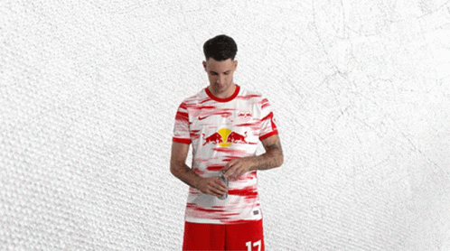 Man In Red And White Shirt With Red Bull GIF