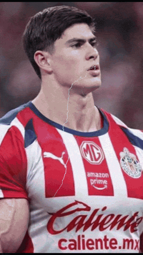 Man in Red and White Striped Shirt Caliente.mx