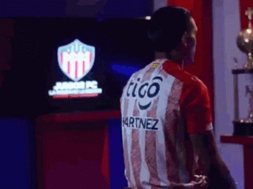 Man In Red And White Striped Shirt Saying Tigo Martinez GIF