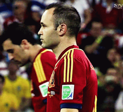 Man in Red and Yellow Jersey Number 2