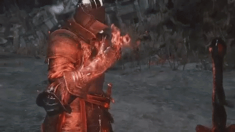 Man In Red Armor And Helmet Holding Sword GIF