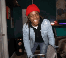 Man In Red Beanie And Denim Jacket Smiling GIF
