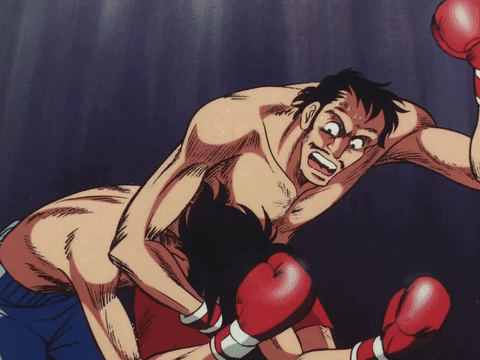 Man in Red Boxing Gloves Being Punched