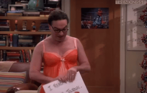 Man in Red Bra Holding Paper Saying I Read Your Journal