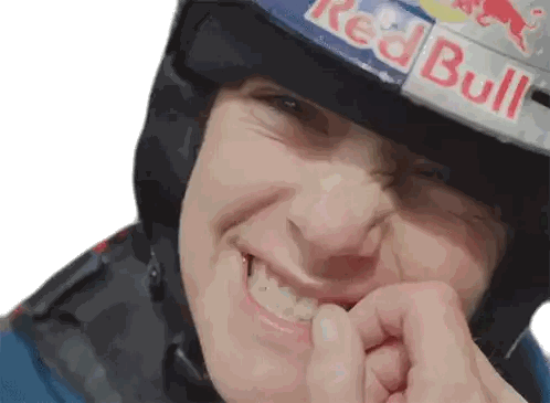 Man in Red Bull Helmet Biting Finger