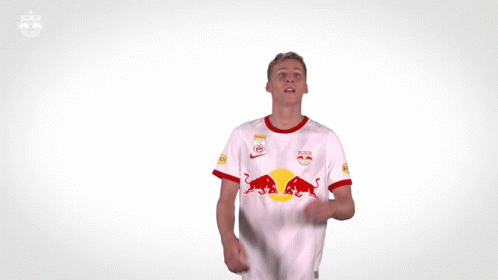Man in Red Bull Jersey Looking at Ball