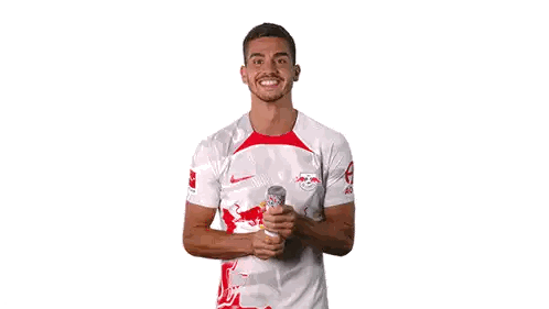 Man in Red Bull Jersey With Falling Confetti