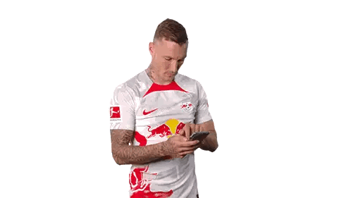 Man in Red Bull Shirt Talking on Phone