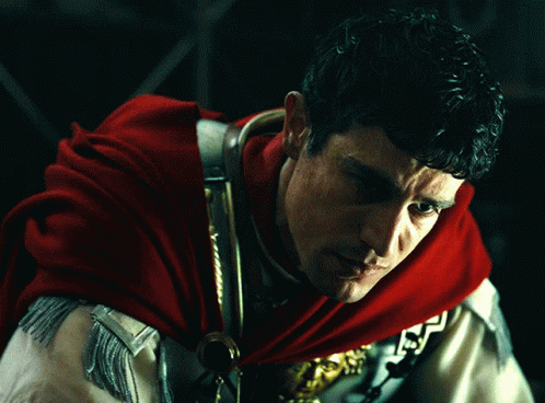Man in Red Cape and Gold Armor