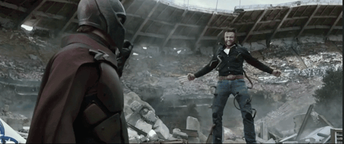 Man In Red Cape Beside Man In Black Jacket GIF