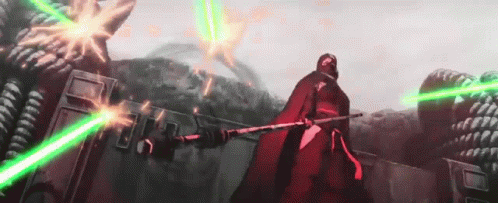 Man in Red Cape Holding Green Lightsaber