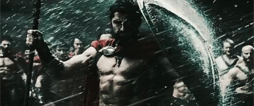 Man in Red Cape Holding Spear and Shield