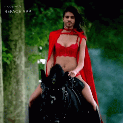 Man in Red Cape Riding Black Horse