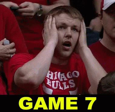 Man In Red Chicago Bulls Shirt Holds Head GIF
