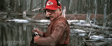 Man in Red Chiefs Hat and Headphones