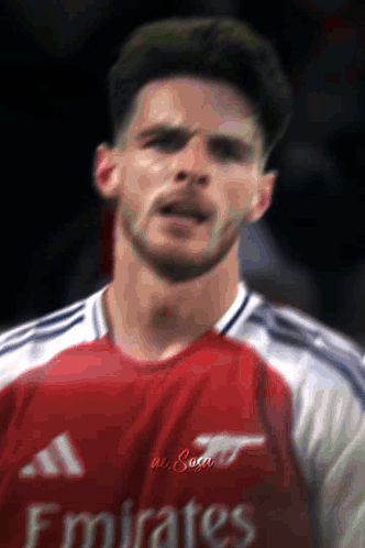 Man In Red Emirates Jersey Close Up GIF
