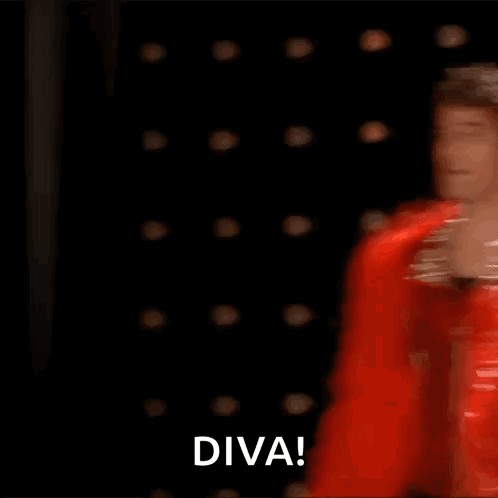Man In Red Feather Boa Dancing On Stage Saying Diva GIF