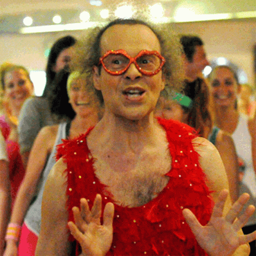 Man In Red Feathers And Glasses GIF