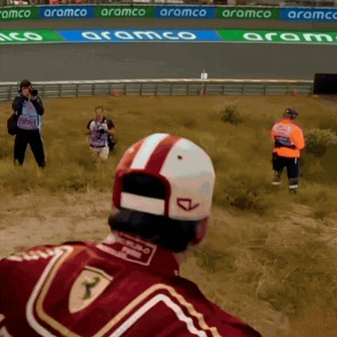 Man in Red Ferrari Jacket in Field
