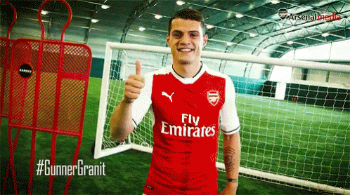Man in Red Fly Emirates Jersey Thumbs Up