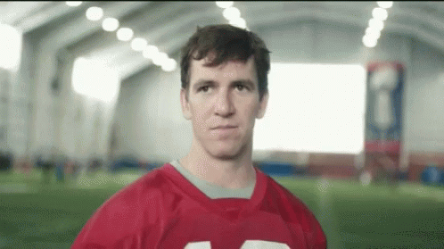Man in Red Football Jersey Looking at Camera