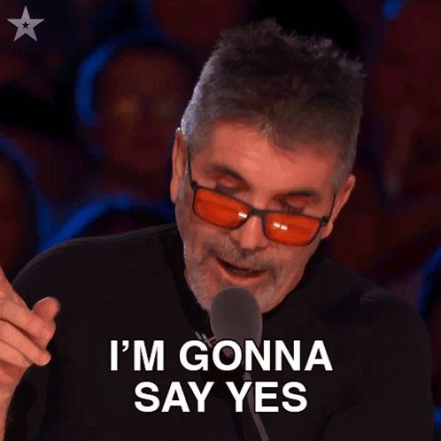 Man in Red Glasses and Black Shirt Saying I'm Gonna Say Yes