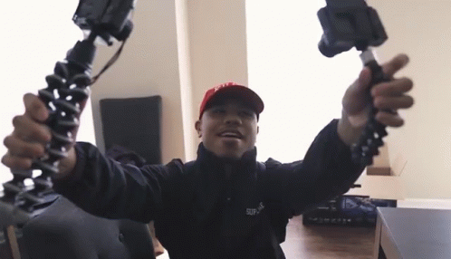 Man In Red Hat And Black Jacket Supreme GIF