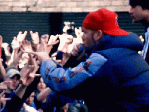 Man In Red Hat And Blue Jacket Singing GIF