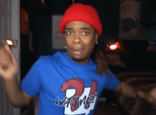 Man in Red Hat and Blue Number 21 Shirt