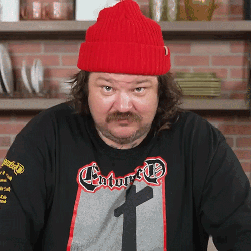 Man in Red Hat and Enforced T-Shirt