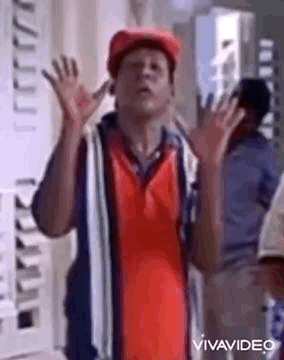 Man In Red Hat And Shirt Making Funny Face GIF