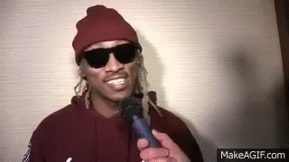 Man in Red Hat and Sunglasses Holding Microphone